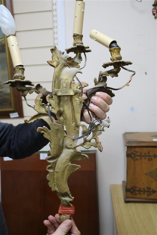 A pair of three branch ormolu wall lights length 55cm